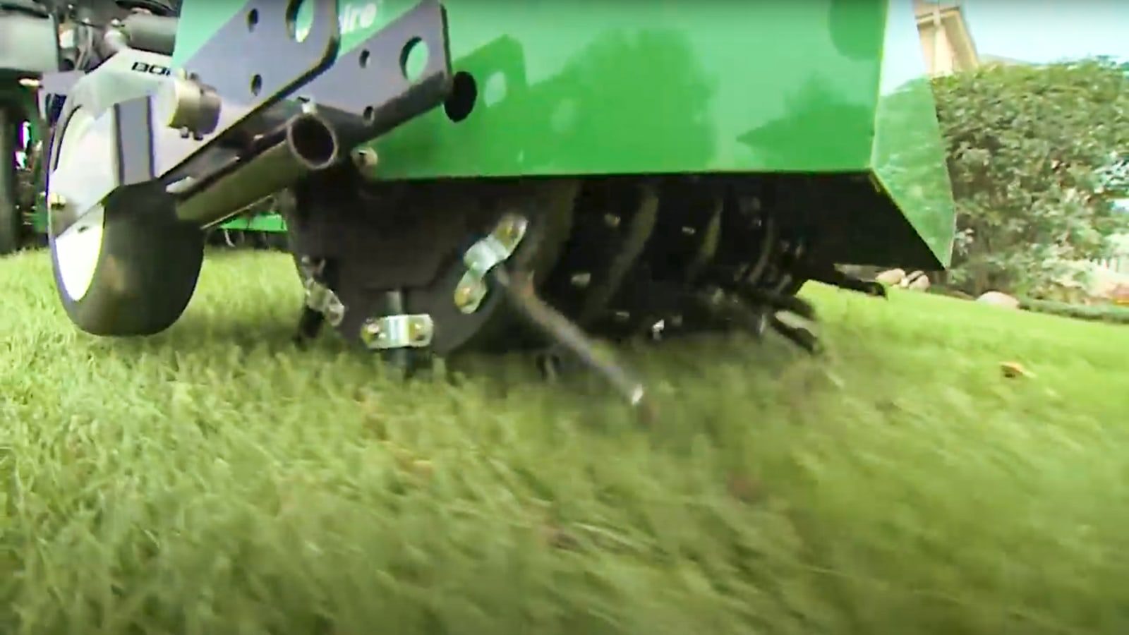 close-up photo of the wheel and tines of a Ryan Renovaire Tow-Behind Aerator